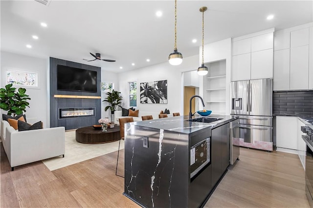 1247 Bridges Ave SW Unit A, Atlanta, GA 30310 - kitchen with appliances with stainless steel finishes, a sink, plenty of natural light, modern cabinets, and recessed lighting