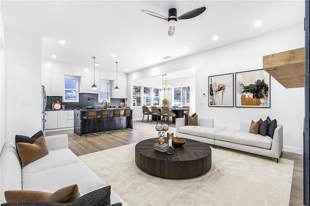1247 Bridges Ave SW Unit A, Atlanta, GA 30310 - living room with light wood-type flooring, a chandelier, recessed lighting, a ceiling fan, and baseboards