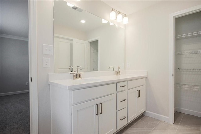 bathroom with vanity and crown molding