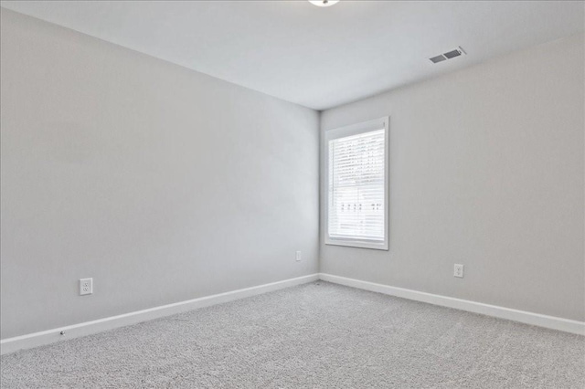 spare room featuring carpet floors