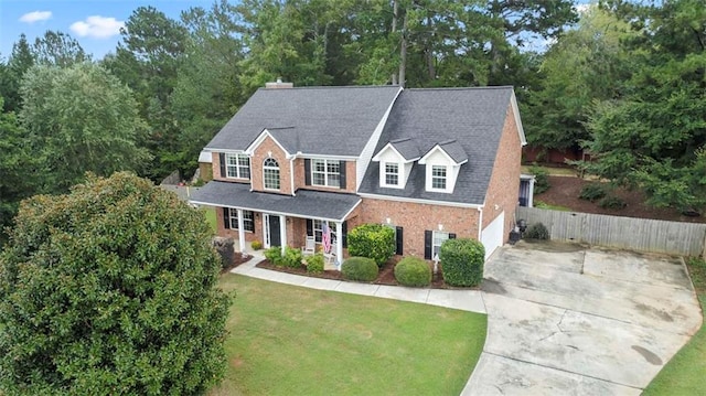 view of front of home featuring a garage and a front lawn