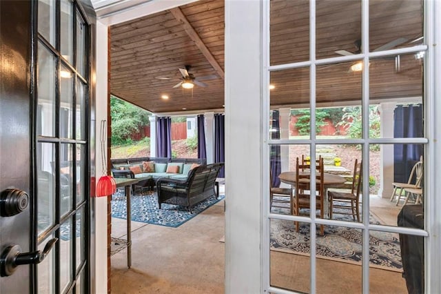 interior space featuring wooden ceiling and ceiling fan