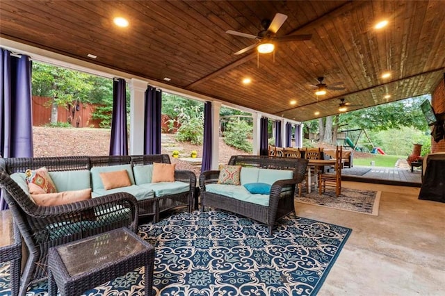 sunroom / solarium featuring ceiling fan and wood ceiling