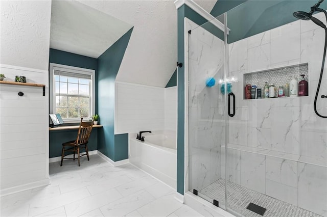 bathroom with shower with separate bathtub