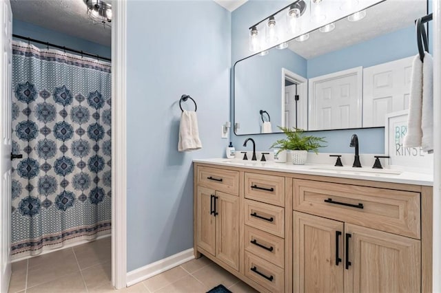 bathroom featuring a shower with shower curtain, tile patterned flooring, and vanity