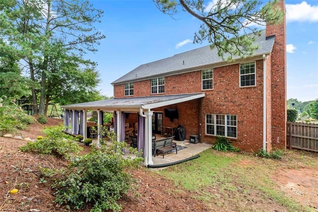 rear view of property with a patio