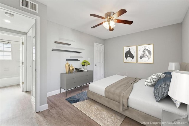 bedroom featuring ceiling fan and wood-type flooring