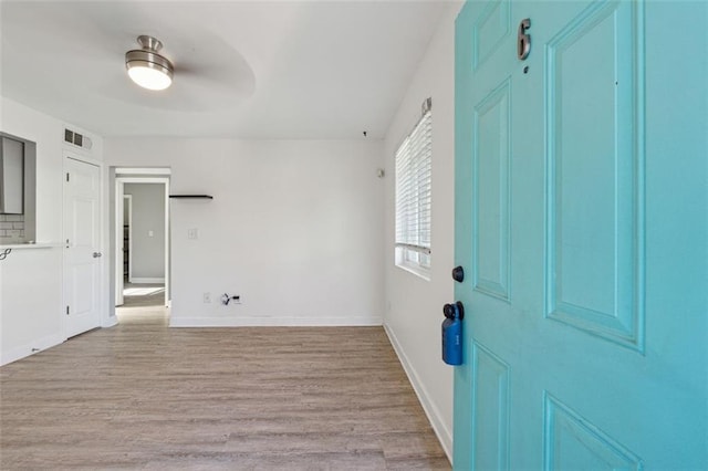 foyer featuring ceiling fan and light hardwood / wood-style floors