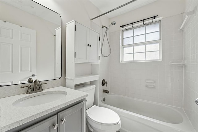 full bathroom featuring vanity, toilet, and tiled shower / bath