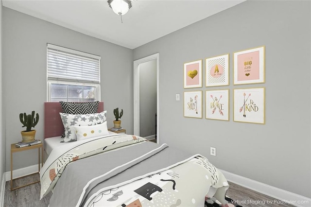 bedroom with wood-type flooring