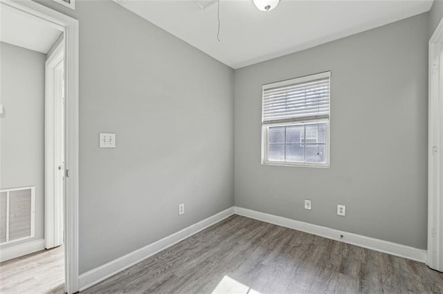 spare room featuring light wood-type flooring