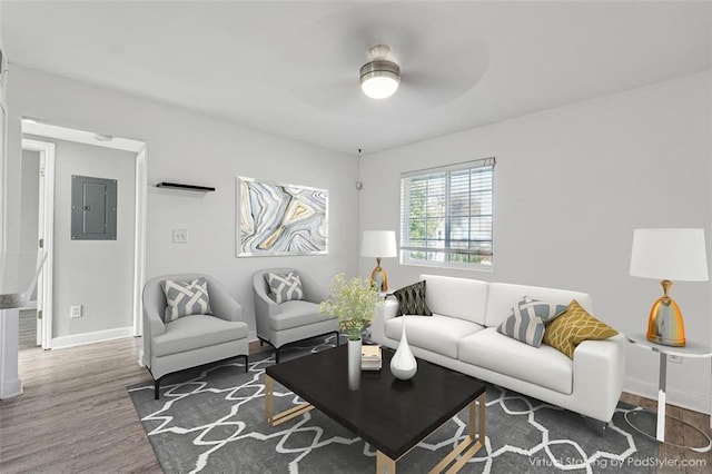 living room with electric panel, dark hardwood / wood-style floors, and ceiling fan