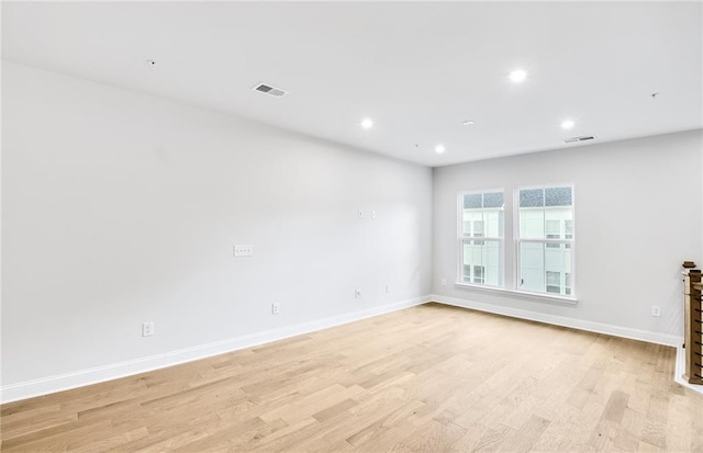 unfurnished room featuring light hardwood / wood-style floors