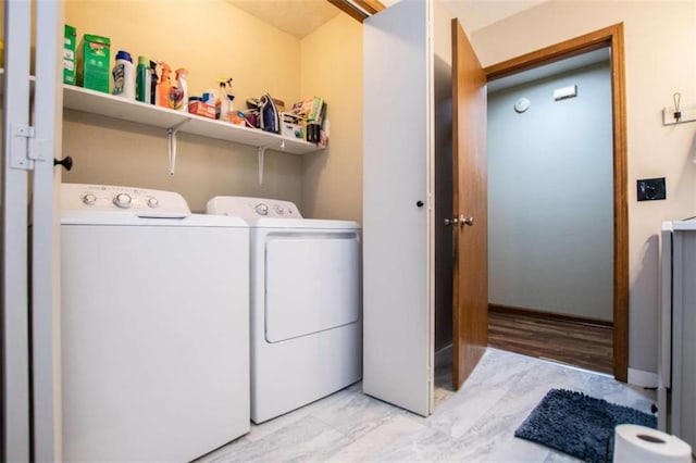 washroom with laundry area and washer and dryer