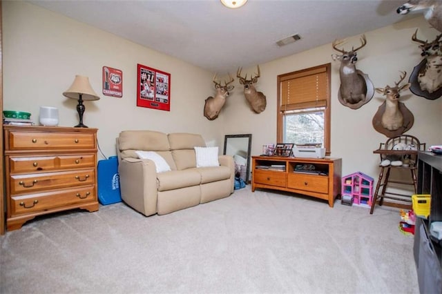 sitting room featuring carpet floors and visible vents