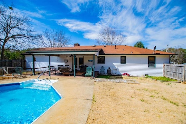 back of house with a ceiling fan, french doors, a patio area, and a fenced backyard