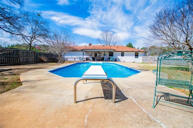 view of swimming pool featuring a patio area, a fenced backyard, and a fenced in pool