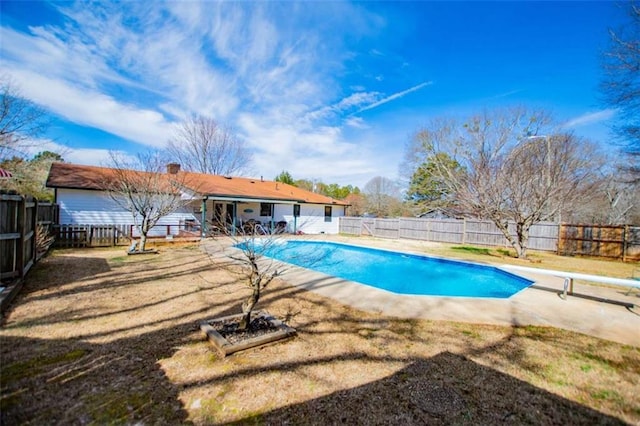 view of pool with a diving board, a patio, a fenced backyard, and a fenced in pool