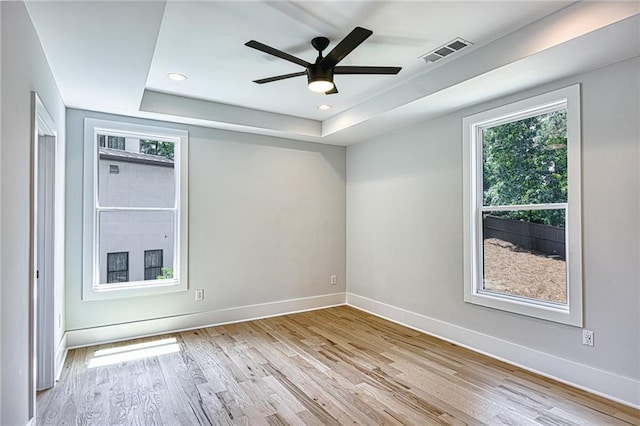 2110 Fairway Cir NE, Brookhaven, GA 30319 - unfurnished room featuring a tray ceiling, light wood-type flooring, baseboards, ceiling fan, and recessed lighting