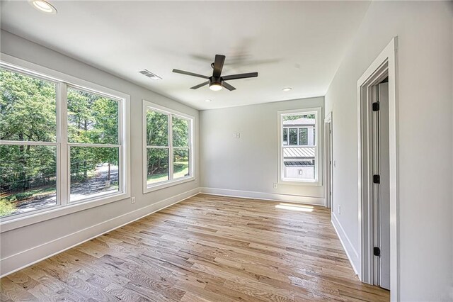2110 Fairway Cir NE, Brookhaven, GA 30319 - spare room featuring plenty of natural light, ceiling fan, light wood-style floors, baseboards, and recessed lighting