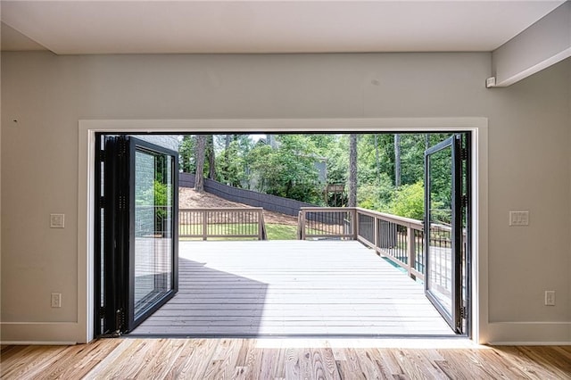 2110 Fairway Cir NE, Brookhaven, GA 30319 - entryway featuring baseboards, wood finished floors, and view of scattered trees