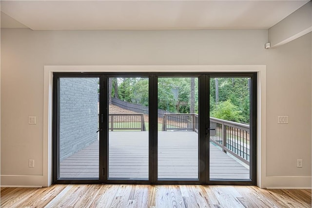 2110 Fairway Cir NE, Brookhaven, GA 30319 - doorway featuring baseboards and wood finished floors