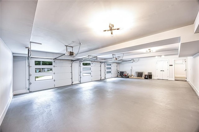 2110 Fairway Cir NE, Brookhaven, GA 30319 - garage featuring a garage door opener and baseboards