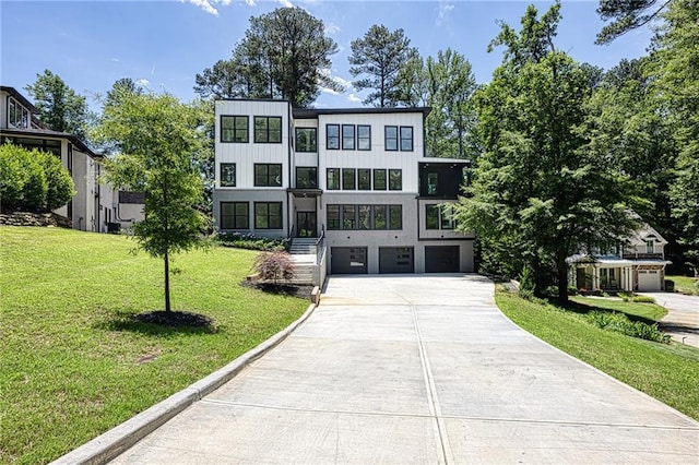 2110 Fairway Cir NE, Brookhaven, GA 30319 - view of front of property featuring concrete driveway, a garage, a front yard, and board and batten siding