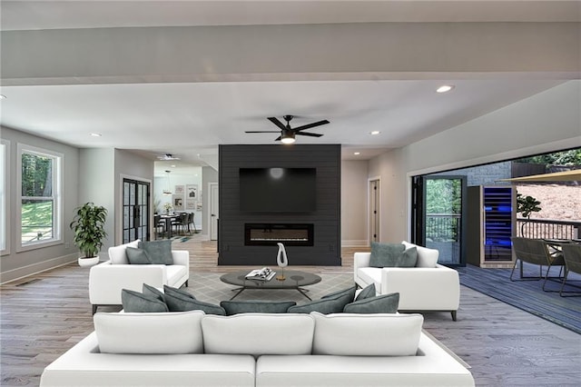 2110 Fairway Cir NE, Brookhaven, GA 30319 - living room with a fireplace, wood finished floors, ceiling fan, recessed lighting, and baseboards