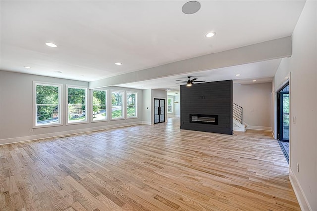 2110 Fairway Cir NE, Brookhaven, GA 30319 - unfurnished living room with baseboards, light wood-style floors, recessed lighting, ceiling fan, and a fireplace