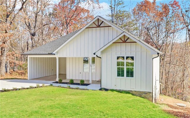 view of outbuilding featuring a lawn