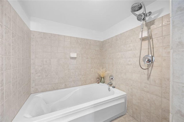 bathroom featuring tiled shower, tile walls, and a bath