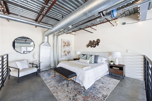 bedroom featuring finished concrete flooring