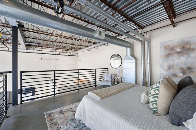 bedroom featuring finished concrete floors