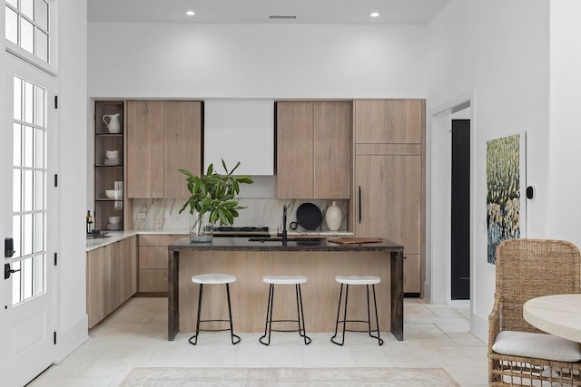11273 Serenbe Ln, Chattahoochee Hills, GA 30268 - kitchen featuring a center island, a towering ceiling, plenty of natural light, and light tile floors
