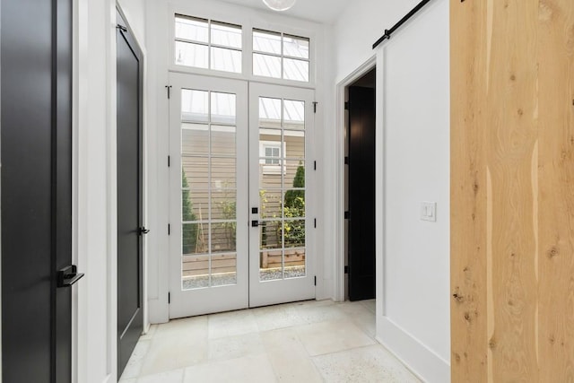 11273 Serenbe Ln, Chattahoochee Hills, GA 30268 - doorway to outside featuring plenty of natural light, french doors, a barn door, and light tile flooring