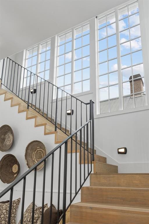 11273 Serenbe Ln, Chattahoochee Hills, GA 30268 - stairs with a wealth of natural light and hardwood / wood-style floors