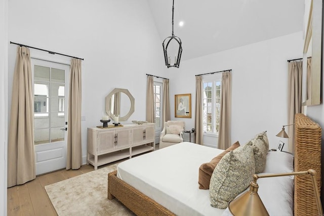 11273 Serenbe Ln, Chattahoochee Hills, GA 30268 - bedroom featuring light hardwood / wood-style floors and high vaulted ceiling