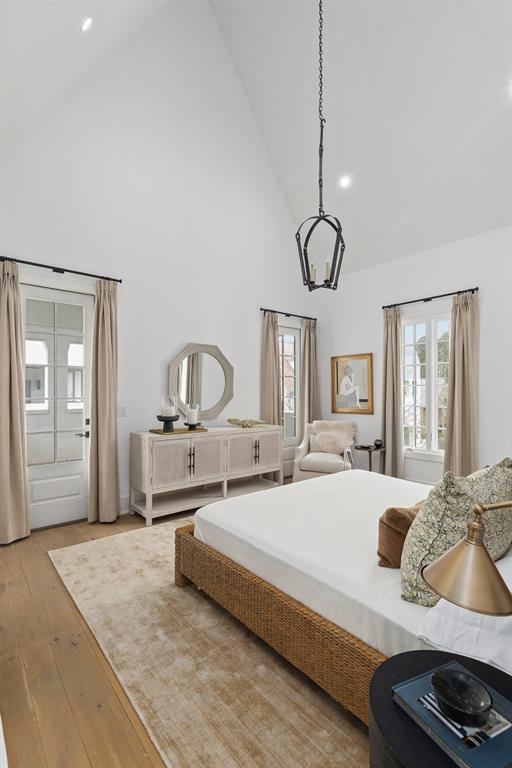 11273 Serenbe Ln, Chattahoochee Hills, GA 30268 - bedroom featuring high vaulted ceiling and light hardwood / wood-style floors
