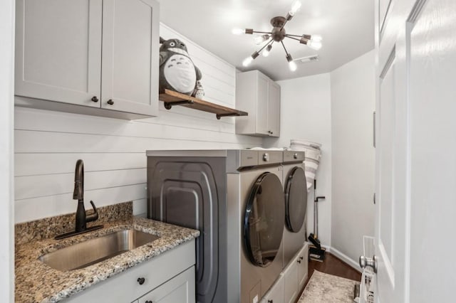4944 Dovecote Trl, Suwanee, GA 30024 - washroom with washer and dryer, cabinet space, and wood finished floors