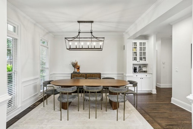 4944 Dovecote Trl, Suwanee, GA 30024 - dining room with dark wood-type flooring, a wainscoted wall, a chandelier, and crown molding