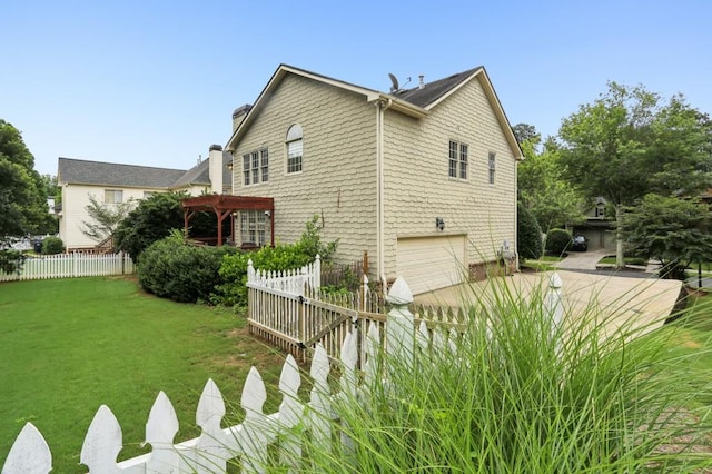 4944 Dovecote Trl, Suwanee, GA 30024 - view of home's exterior with an attached garage, a chimney, and driveway