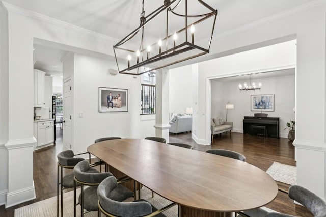 4944 Dovecote Trl, Suwanee, GA 30024 - dining area with dark wood-style floors, a chandelier, ornamental molding, and ornate columns