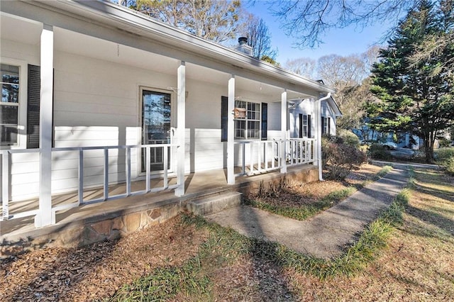 doorway to property featuring covered porch