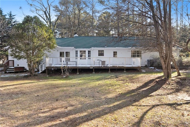 back of house featuring a chimney and a deck