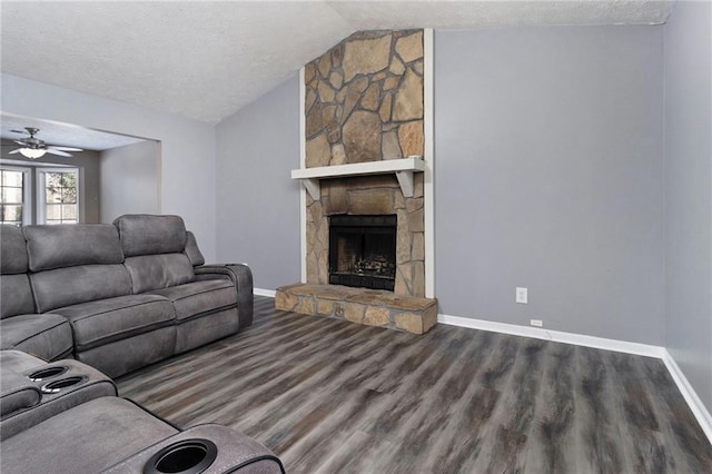 unfurnished living room with a fireplace, baseboards, vaulted ceiling, and wood finished floors