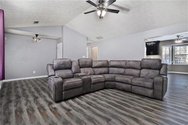 living room with lofted ceiling, a textured ceiling, wood finished floors, a ceiling fan, and baseboards