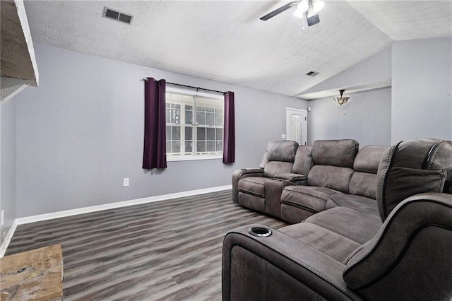 living room with baseboards, visible vents, wood finished floors, vaulted ceiling, and a textured ceiling