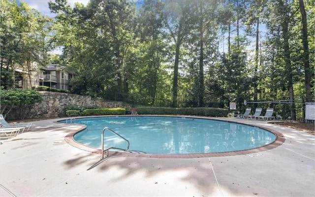 view of pool featuring a patio area