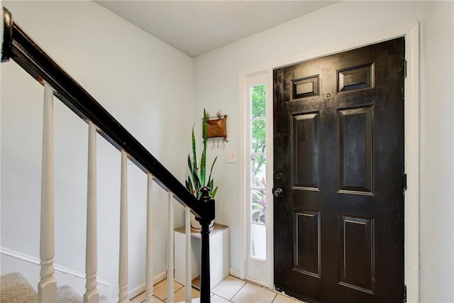 view of tiled foyer entrance